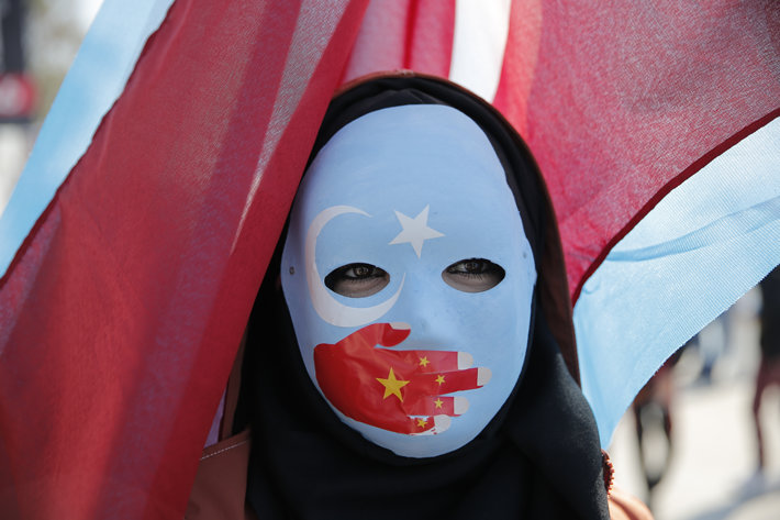 Ethnic Uyghur protest against China’s repression. (Photo by Lumiereist, Shutterstock.com)